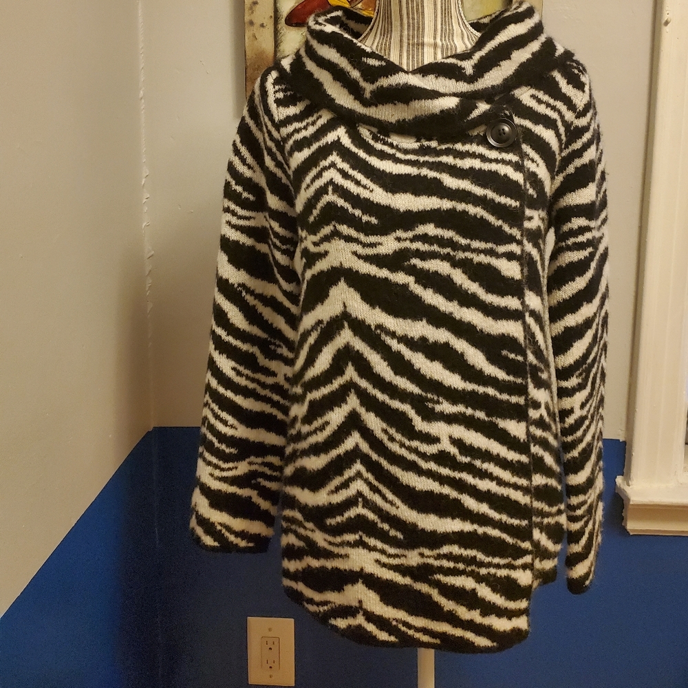 Stylist sweater/heavy enough to wear as a light jacket